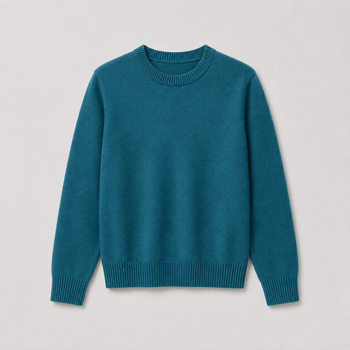 A teal blue crewneck knit sweater with ribbed collar, cuffs, and hem, displayed flat against a light gray background.